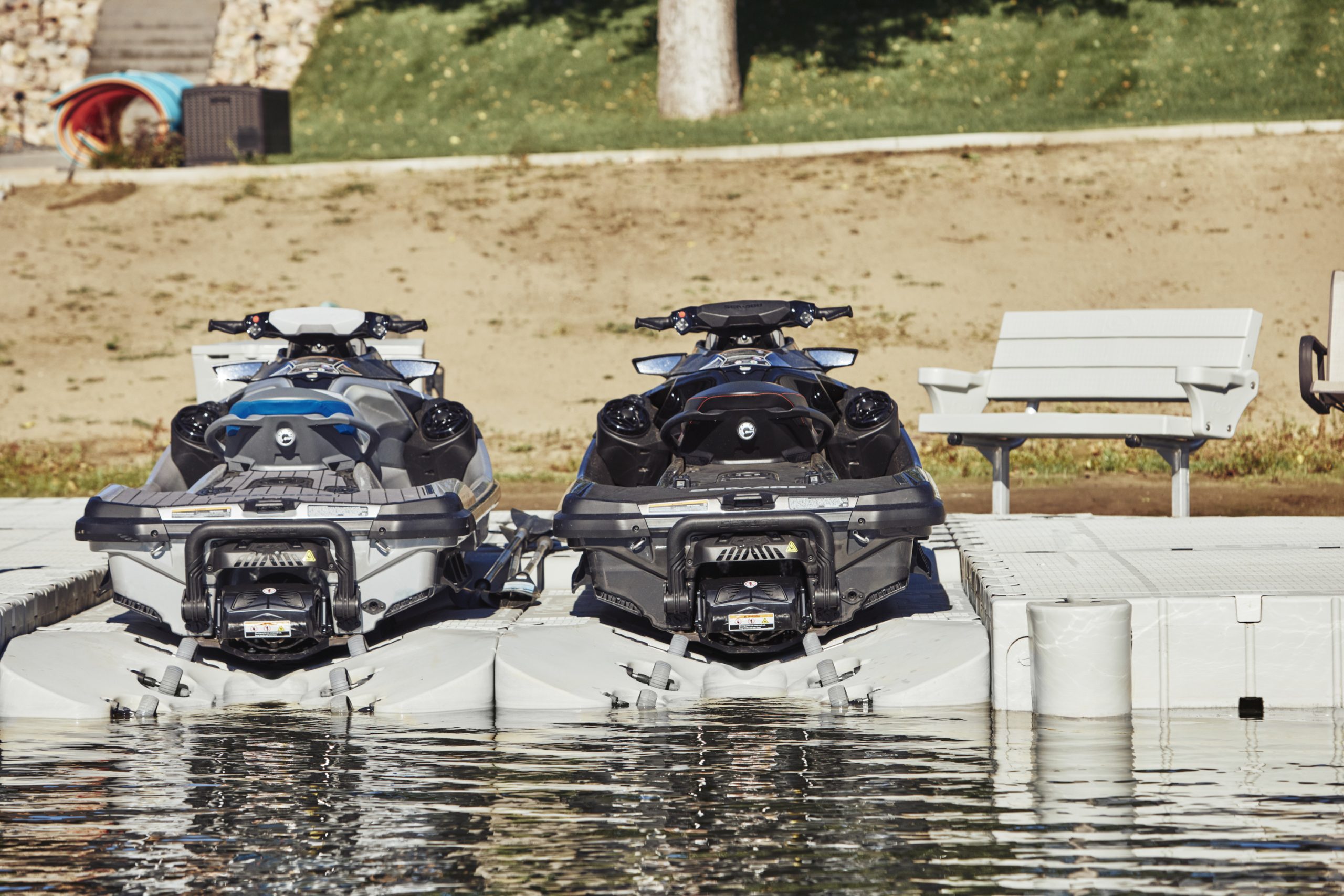 Jet skis docked on the water