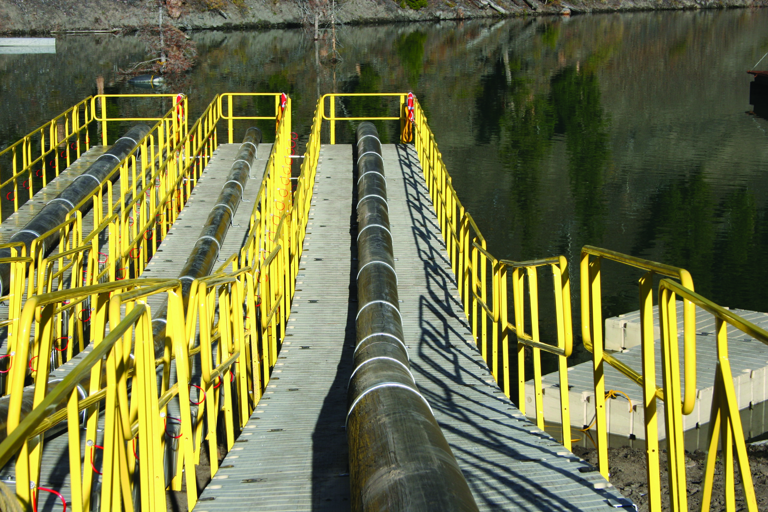 A pipe runs downs a dock