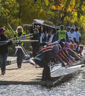 Team of rowers on a rowing dock