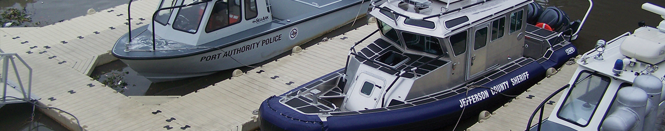 Police boats parked on floating dock
