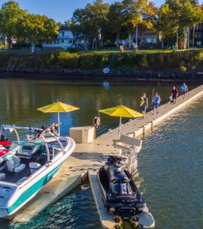 Boats and jet skis on floating dock sections