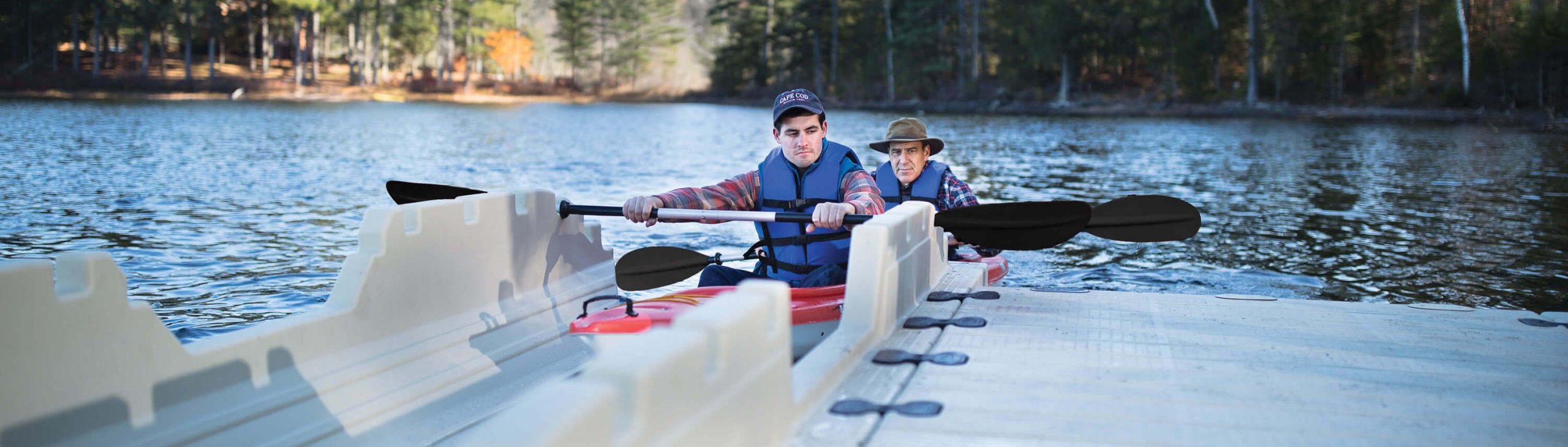 Father and son on kayak launch