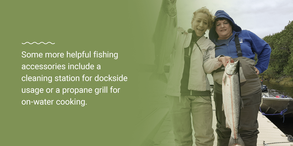 Two women holding two fish