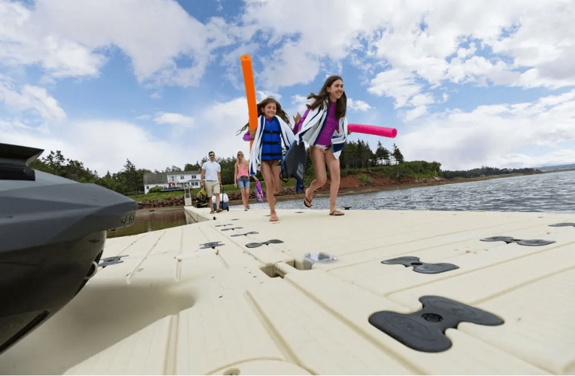 Kids running on a dock