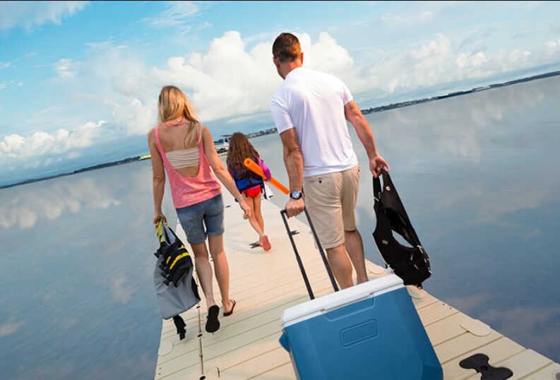 Family walking on a floating dock